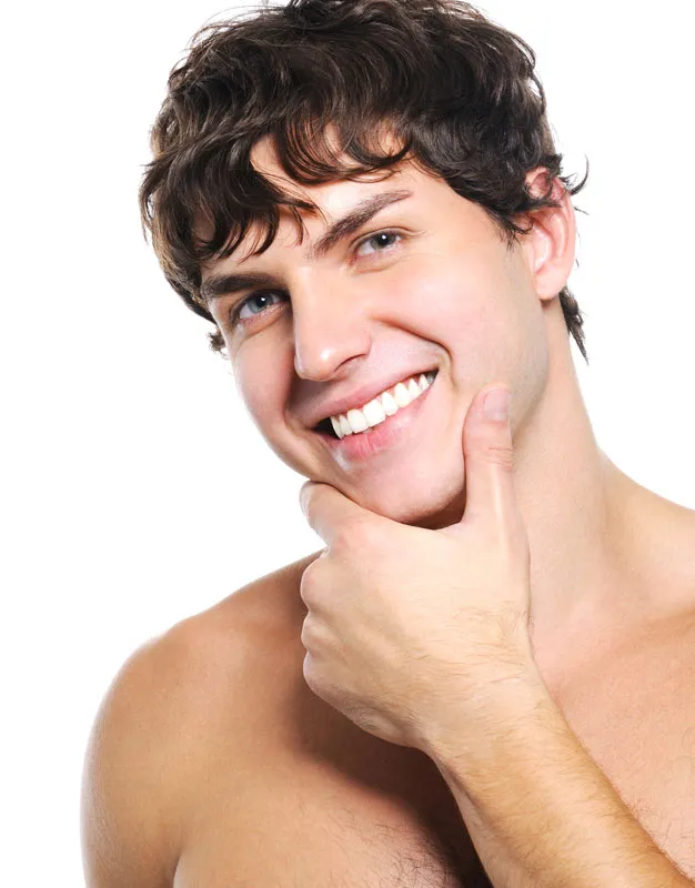 Acne-Mix-IV-Therapy-Treatment A young man touches his smooth, acne-free face. Get IV Therapy for acne from Guerda Johnson, FNP-C in Tyler East Texas Area.