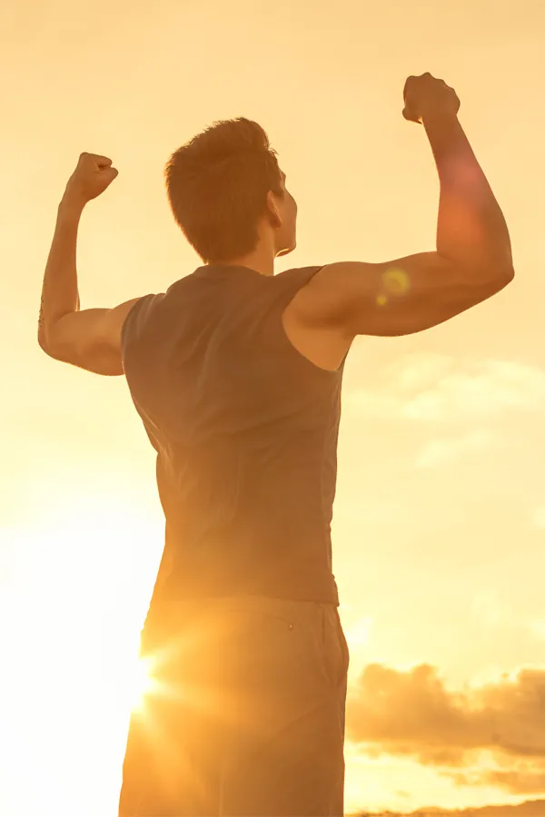 Bella-Capsules-for-Weight-Loss-Treatment A healthy man raises his arms to the sunrise. Get Bella Capsules for weight loss treatment from Guerda Johnson, FNP-C in Tyler East Texas Area.