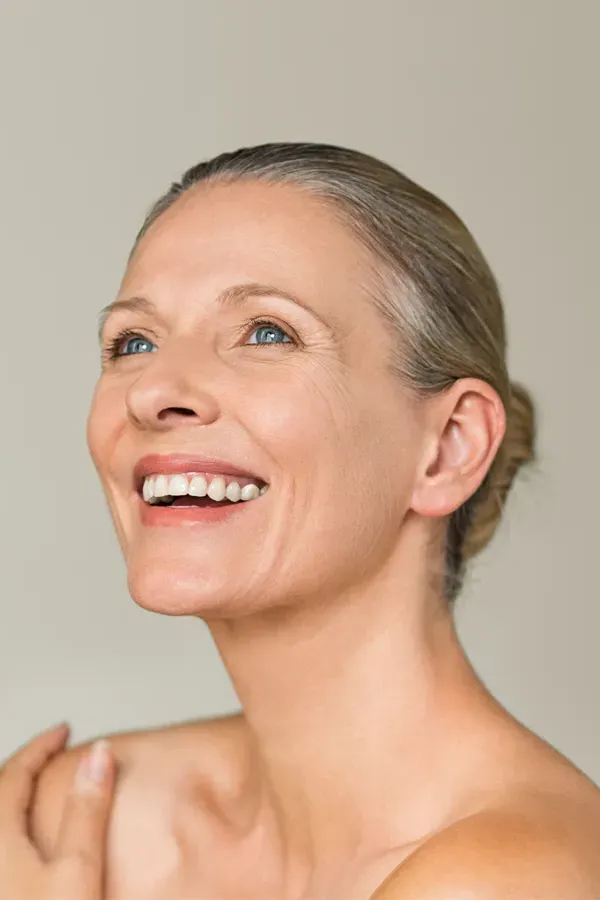 Biotin-IV-Therapy-Treatment A middle-aged woman with smooth, beautiful skin. Get Biotin IV therapy from Guerda Johnson, FNP-C in Tyler East Texas Area.