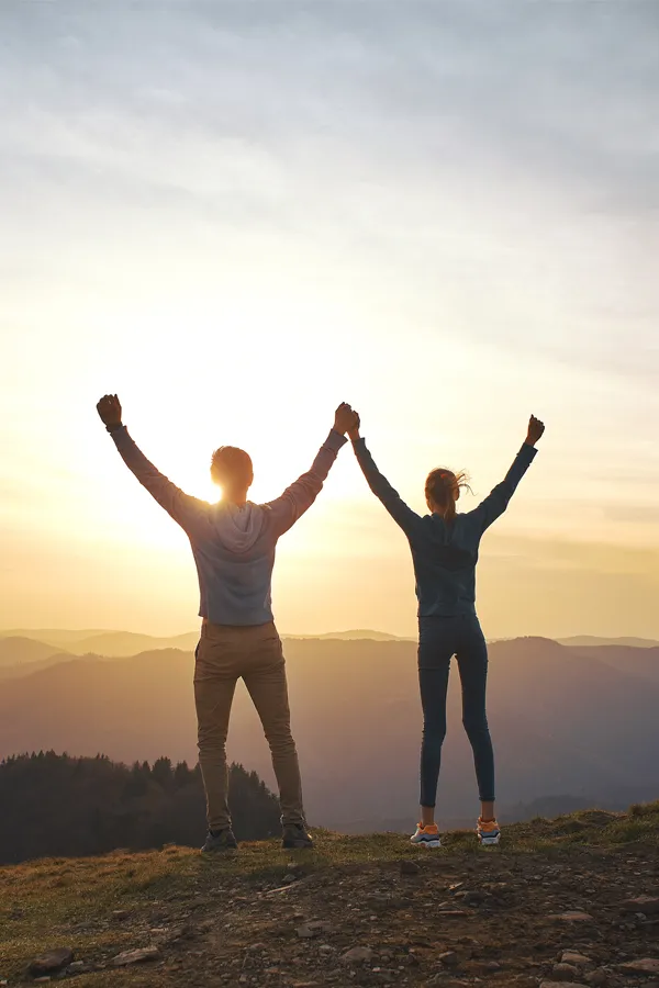 DHEA-Hormone-Treatment A couple join hands and raise them to the sunrise. Get DHEA Hormones for weight loss treatment from Guerda Johnson, FNP-C in Tyler East Texas Area.