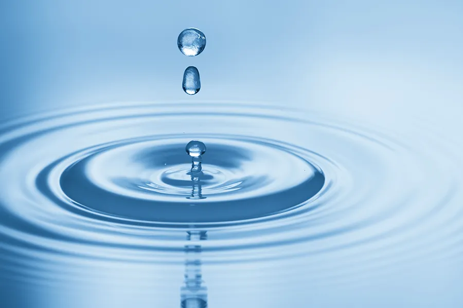 Hydration-IV-Therapy-Clinic Drops of water rippling in a smooth pool. Get Hydration IV Therapy from Guerda Johnson, FNP-C in Tyler East Texas Area.