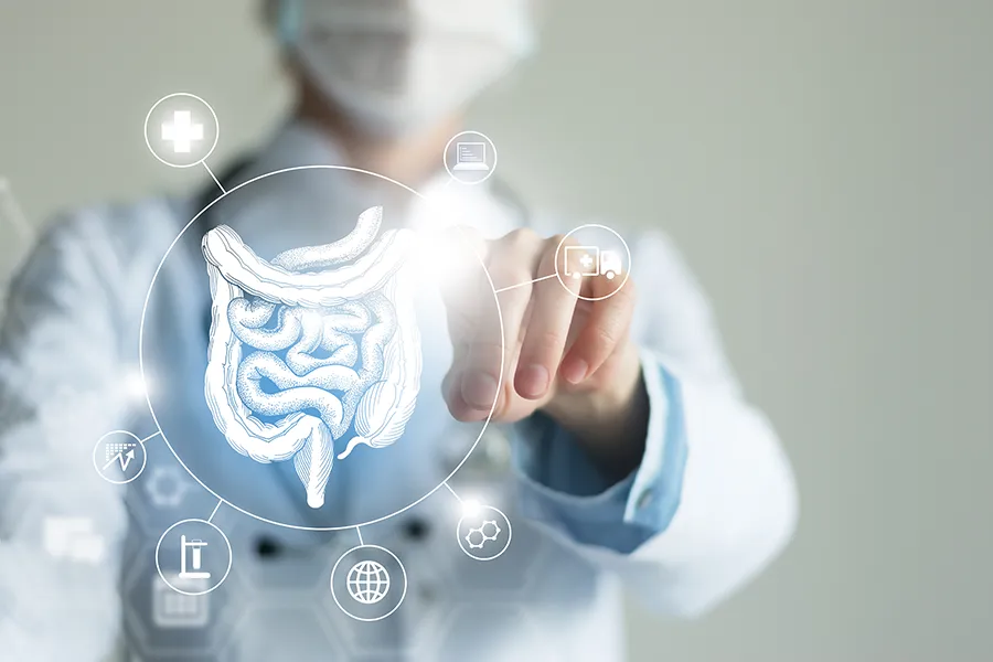 Leaky-Gut-Syndrome-Clinic Guerda Johnson, FNP-C provides advanced Functional Medicine for Leaky Gut Syndrome treatments in Tyler East Texas Area, shown by a doctor touching a glowing digital intestinal health display.