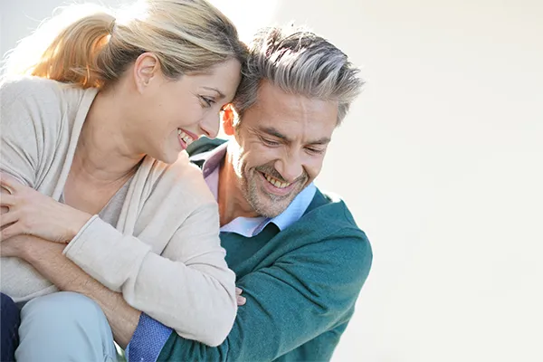 Phendimetrazine-for-Weight-Loss-Clinic A healthy middle-aged couple embrace in the sun. Schedule Phendimetrazine for weight loss treatment from Guerda Johnson, FNP-C in Tyler East Texas Area.