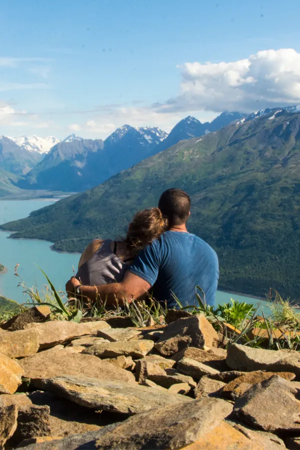 Preventative-Screenings-Treatment A couple embrace on a mountaintop overlooking the horizon. Get a preventative screening from Guerda Johnson, FNP-C in Tyler East Texas Area.