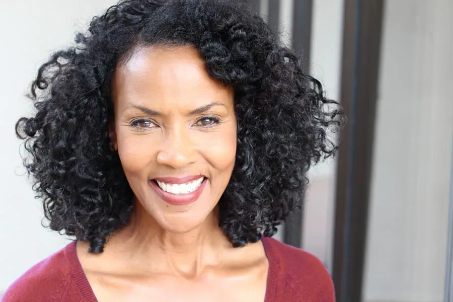 Well-Woman-Exam-Clinic A beautiful, healthy, middle-aged black woman. Schedule Well Woman Exams from Guerda Johnson, FNP-C in Tyler East Texas Area.